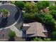 Aerial view of the home and neighborhood with mature trees and well maintained landscaping at 865 E Rojo Ct, Gilbert, AZ 85297