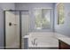 Relaxing bathroom with a soaking tub and separate glass enclosed shower at 865 E Rojo Ct, Gilbert, AZ 85297