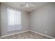 Neutral bedroom with ceiling fan and tiled floors at 865 E Rojo Ct, Gilbert, AZ 85297