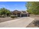 Charming single-story home featuring a well-manicured yard and a two-car garage in a Gathering-friendly neighborhood at 865 E Rojo Ct, Gilbert, AZ 85297