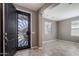 Open foyer featuring a security screen door, neutral paint, and access to the living areas at 865 E Rojo Ct, Gilbert, AZ 85297