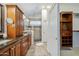 Bathroom boasts dual sinks, dark wood cabinets, a stone tiled shower and walk-in closet at 1001 N Quail Ln, Gilbert, AZ 85233