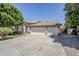 Charming single story home featuring a three car garage and desert landscaping at 1001 N Quail Ln, Gilbert, AZ 85233
