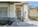 Covered front door with decorative pillars at 1001 N Quail Ln, Gilbert, AZ 85233