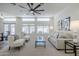 Bright living room with high ceilings, comfortable furniture, and large windows at 1001 N Quail Ln, Gilbert, AZ 85233