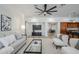 Open-concept living space showcases neutral tones, modern furnishings, and seamless transitions between the living and kitchen areas at 1001 N Quail Ln, Gilbert, AZ 85233