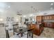 A bright and open-concept floor plan seamlessly connects the living, dining, and kitchen areas with custom finishes at 1001 N Quail Ln, Gilbert, AZ 85233
