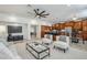 Expansive living space showcases an open layout, blending the living room, dining area, and kitchen for seamless entertaining at 1001 N Quail Ln, Gilbert, AZ 85233