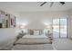 Bright main bedroom featuring a ceiling fan, ensuite bathroom and sliding door access to the pool at 1001 N Quail Ln, Gilbert, AZ 85233