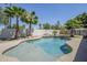 Enjoy this backyard pool surrounded by mature palm trees and landscaping creating a tropical oasis at 1001 N Quail Ln, Gilbert, AZ 85233