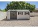 A charming shed provides additional storage space within the property's fenced backyard at 1001 N Quail Ln, Gilbert, AZ 85233