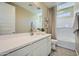 Bright bathroom featuring a large vanity, ample counter space, and a shower/tub combo, providing both style and practicality at 10149 E Ursula Ave, Mesa, AZ 85212