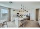 Modern kitchen with white cabinets, stainless appliances, and a center island at 10149 E Ursula Ave, Mesa, AZ 85212