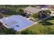 Aerial view of a community park featuring a basketball court, playground, and covered seating area, perfect for recreation at 10149 E Ursula Ave, Mesa, AZ 85212