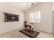 Bedroom featuring simple decor, a chair, and an area rug at 10287 E Verbena Ln, Scottsdale, AZ 85255