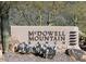 Attractive community sign at McDowell Mountain Ranch surrounded by desert landscaping, reflecting the area's natural beauty at 10287 E Verbena Ln, Scottsdale, AZ 85255