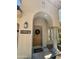 Inviting front entrance with a decorative wreath, arched entryway, and lantern, creating a welcoming first impression at 10287 E Verbena Ln, Scottsdale, AZ 85255