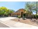 Inviting single-story home with desert landscaping, a three-car garage and plenty of curb appeal at 10287 E Verbena Ln, Scottsdale, AZ 85255