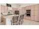Well-equipped kitchen with island seating, stainless appliances, and ample storage at 10287 E Verbena Ln, Scottsdale, AZ 85255