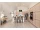 Bright and airy kitchen with seating, stainless steel appliances and warm-toned cabinetry at 10287 E Verbena Ln, Scottsdale, AZ 85255