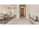 Bright and airy living room featuring beautiful tile flooring, large windows and neutral décor at 10287 E Verbena Ln, Scottsdale, AZ 85255