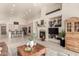Open-concept living space with fireplace and built-in shelving connecting to the kitchen area at 10287 E Verbena Ln, Scottsdale, AZ 85255