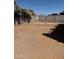 View of the expansive backyard area with cinder block wall and greenery at 10528 W Jessie Ln, Peoria, AZ 85383