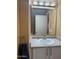 The bathroom features a vanity with a sink, countertop, and a mirror at 10528 W Jessie Ln, Peoria, AZ 85383