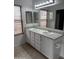 Bathroom with a double vanity and a large mirror at 10528 W Jessie Ln, Peoria, AZ 85383