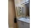 Bathroom featuring a vanity with a white countertop and traditional framed mirror at 10528 W Jessie Ln, Peoria, AZ 85383