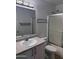 Bathroom featuring a shower, toilet, and sink with an extended countertop at 10528 W Jessie Ln, Peoria, AZ 85383
