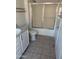Bathroom featuring a tub with sliding glass doors, a toilet, and single sink vanity at 10528 W Jessie Ln, Peoria, AZ 85383