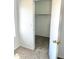A bright bedroom view showcasing the door to the walk-in closet with ample storage at 10528 W Jessie Ln, Peoria, AZ 85383