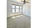 A sunlit bedroom featuring three windows with privacy shades and a ceiling fan at 10528 W Jessie Ln, Peoria, AZ 85383