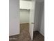 A bright bedroom view showcasing the door to the walk-in closet with ample storage at 10528 W Jessie Ln, Peoria, AZ 85383