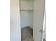 A tidy, walk-in closet with carpeting and a built-in shelf for organized storage at 10528 W Jessie Ln, Peoria, AZ 85383