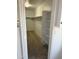 Spacious walk-in closet with carpet and built-in shelving for optimal storage solutions at 10528 W Jessie Ln, Peoria, AZ 85383