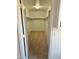 Carpeted walk-in closet includes a hanging rod and overhead light fixture at 10528 W Jessie Ln, Peoria, AZ 85383