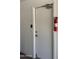 A white door with a fire extinguisher is located on a white wall inside at 10528 W Jessie Ln, Peoria, AZ 85383