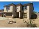 Two-story home with low maintenance yard and desert landscaping and neutral color palette at 10528 W Jessie Ln, Peoria, AZ 85383