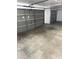Spacious two car garage with concrete floors and paneled doors at 10528 W Jessie Ln, Peoria, AZ 85383