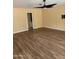 Spacious living room with hardwood floors and a ceiling fan at 10528 W Jessie Ln, Peoria, AZ 85383