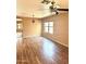 Spacious open-concept living room with modern light fixture and ceiling fan at 10528 W Jessie Ln, Peoria, AZ 85383