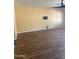 The living room features wood floors and a ceiling fan at 10528 W Jessie Ln, Peoria, AZ 85383