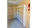 Walk-in pantry with lots of storage with many white shelves at 10528 W Jessie Ln, Peoria, AZ 85383