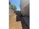 A narrow side yard offers privacy with block walls and ample space for utilities at 10528 W Jessie Ln, Peoria, AZ 85383
