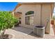 Well-maintained backyard featuring a patio and desert landscaping at 10652 W Coronado Rd, Avondale, AZ 85392