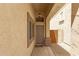 Inviting front entrance featuring a secure screen door and stylish outdoor lighting at 10652 W Coronado Rd, Avondale, AZ 85392