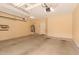 Spacious garage with concrete flooring, overhead lighting, and ample room for storage at 10652 W Coronado Rd, Avondale, AZ 85392