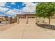 Home featuring a two-car garage, well-kept landscaping, and a tile roof on a sunny day at 10652 W Coronado Rd, Avondale, AZ 85392